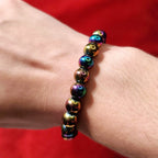 Rainbow hematite beaded bracelet worn on wrist, minimalist multicolor gemstone jewelry by Corona Charms